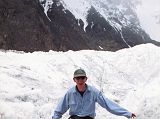 20 Jerome Ryan Crossing Log Bridge On Abruzzi Glacier On the way back to Shagring camp from Gasherbrum Base Camp, Jerome Ryan had to cross a small log bridge on the Abruzzi Glacier.